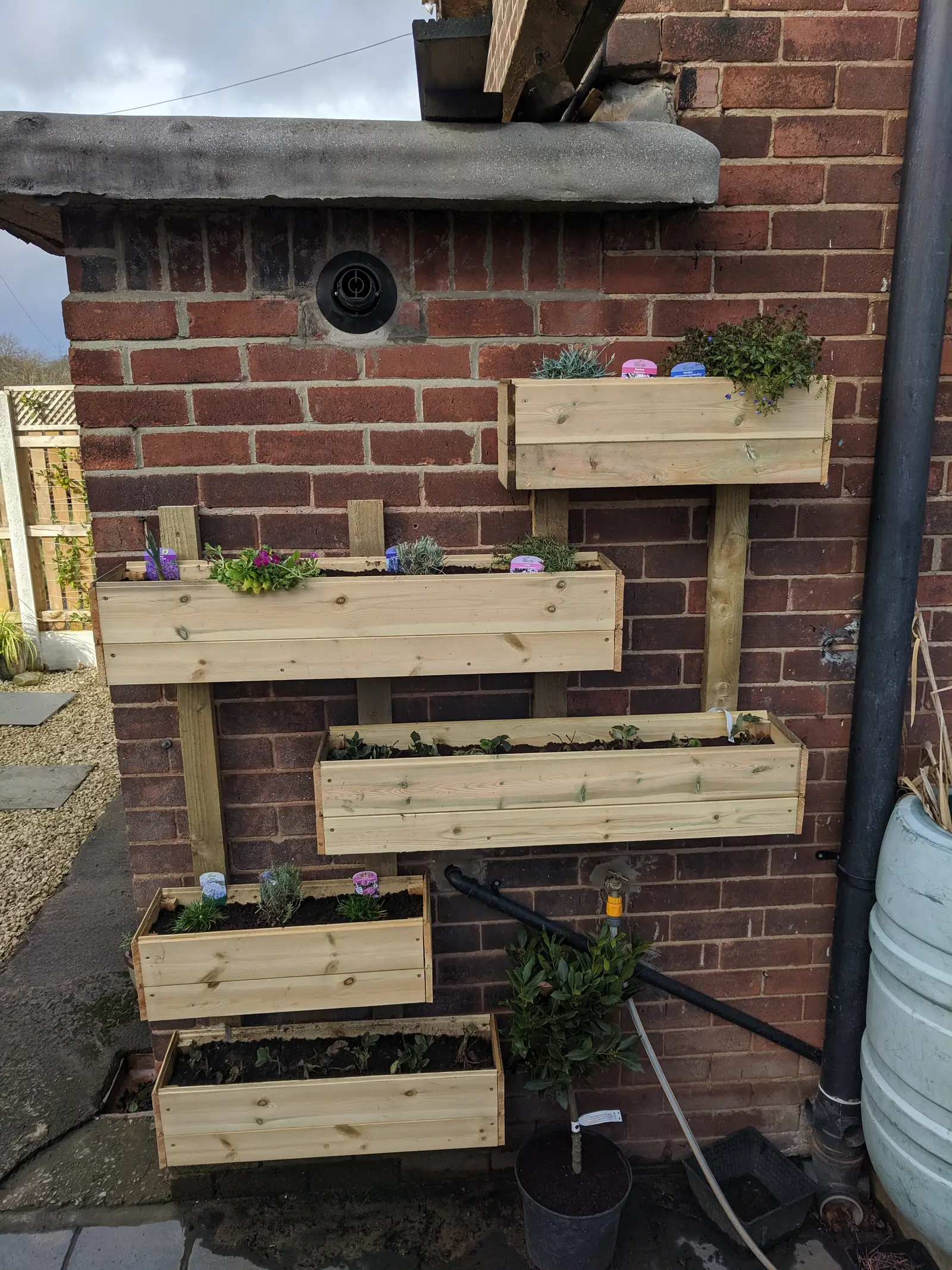 Building and installing wall planters